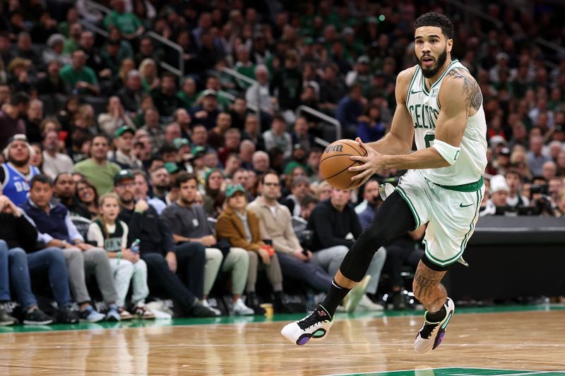 BOSTON, MASSACHUSETTS - JANUARY 10: Jayson Tatum #0 of the Boston Celtics drives to the basket against the Minnesota Timberwolves  at TD Garden on January 10, 2024 in Boston, Massachusetts. The Celtics defeat the Timberwolves 127-120 in overtime. NOTE TO USER: User expressly acknowledges and agrees that, by downloading and or using this photograph, user is consenting to the terms and conditions of the Getty Images License Agreement.  (Photo by Maddie Meyer/Getty Images)