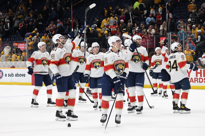 Jan 22, 2024; Nashville, Tennessee, USA; Florida Panthers players celebrate after a win against the Nashville Predators at Bridgestone Arena. Mandatory Credit: Christopher Hanewinckel-USA TODAY Sports