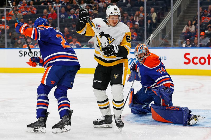 Oct 25, 2024; Edmonton, Alberta, CAN; Pittsburgh Penguins forward Rickard Rakell (67) tries to screen Edmonton Oilers goaltender Stuart Skinner (74) during the second period at Rogers Place. Mandatory Credit: Perry Nelson-Imagn Images