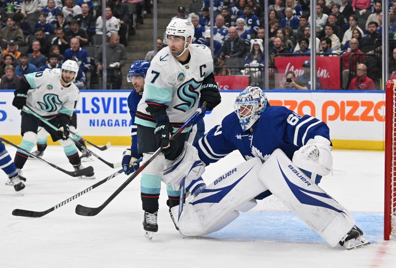 Oct 31, 2024; Toronto, Ontario, CAN;  Toronto Maple Leafs goalie Joseph Woll (60) defends his goal against Seattle Kraken forward Jordan Eberle (7) in the second period at Scotiabank Arena. Mandatory Credit: Dan Hamilton-Imagn Images