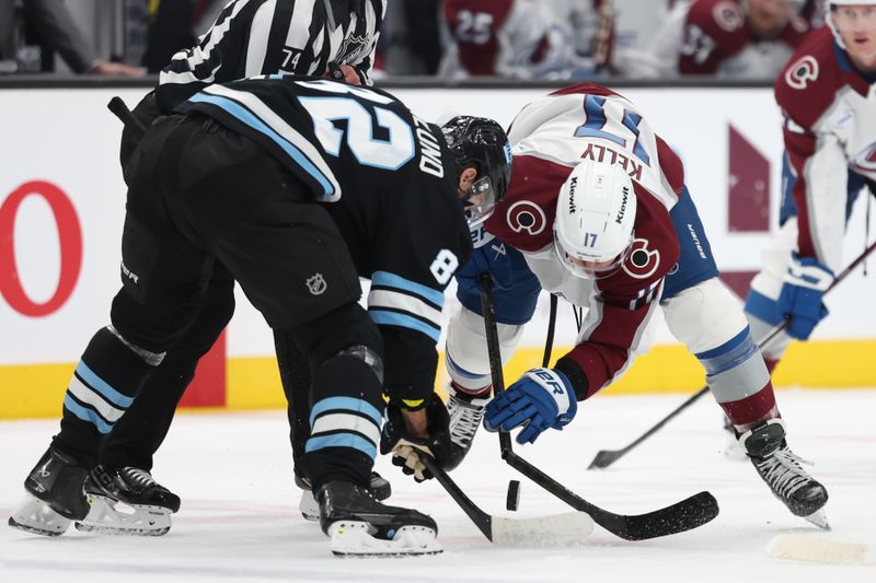 Oct 24, 2024; Salt Lake City, Utah, USA; Utah Hockey Club center Kevin Stenlund (82) and Colorado Avalanche center Parker Kelly (17) face off during the second period at Delta Center. Mandatory Credit: Rob Gray-Imagn Images