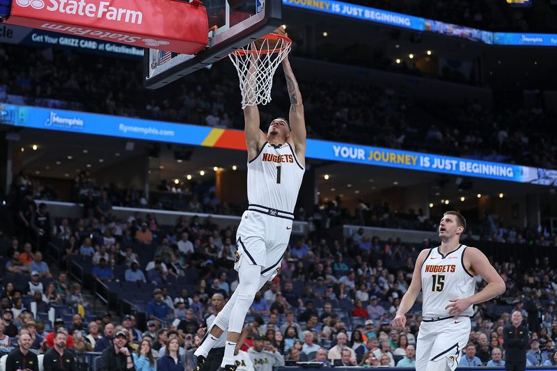 MEMPHIS, TENNESSEE - APRIL 14: Michael Porter Jr. #1 of the Denver Nuggets goes to the basket during the first half against the Memphis Grizzlies at FedExForum on April 14, 2024 in Memphis, Tennessee. NOTE TO USER: User expressly acknowledges and agrees that, by downloading and or using this photograph, User is consenting to the terms and conditions of the Getty Images License Agreement. (Photo by Justin Ford/Getty Images)