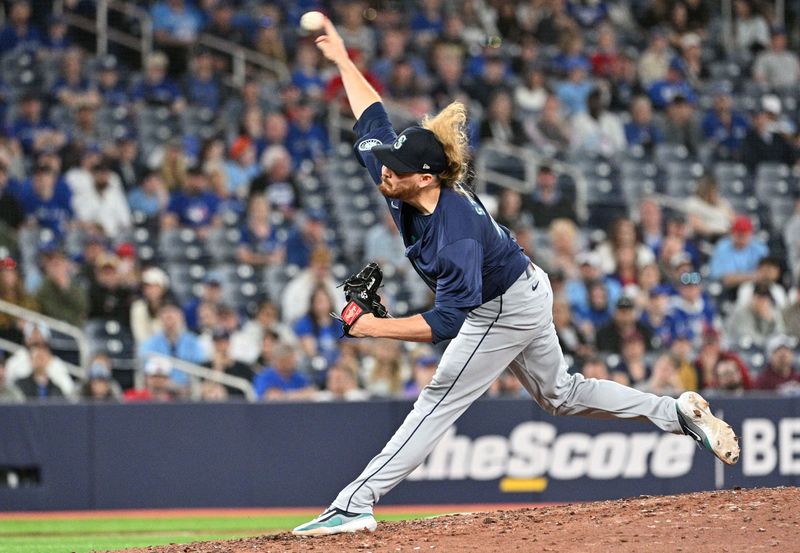 Apr 10, 2024; Toronto, Ontario, CAN;  Seattle Mariners relief pitcher Ryne Stanek (45) delivers a pitch against the Toronto Blue Jays in the 10th inning at Rogers Centre. Mandatory Credit: Dan Hamilton-USA TODAY Sports