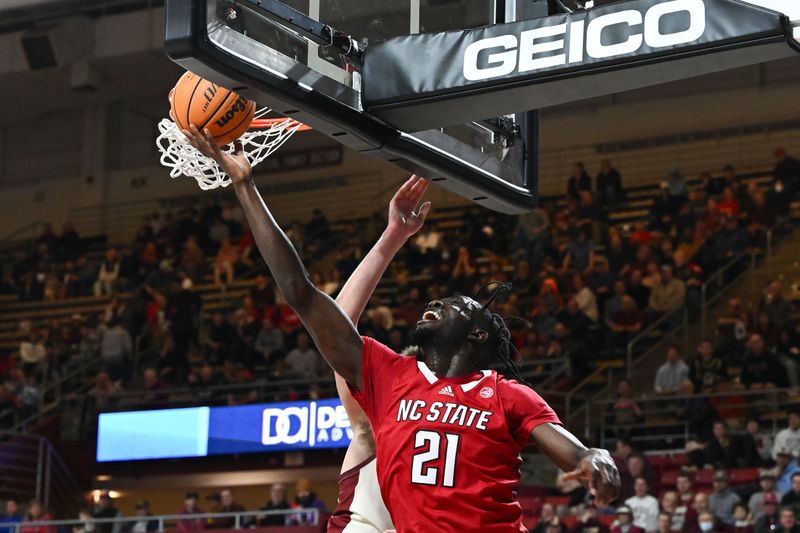 Feb 11, 2023; Chestnut Hill, Massachusetts, USA; North Carolina State Wolfpack forward Ebenezer Dowuona (21) attempts a layup against the Boston College Eagles during the first half at the Conte Forum. Mandatory Credit: Brian Fluharty-USA TODAY Sports