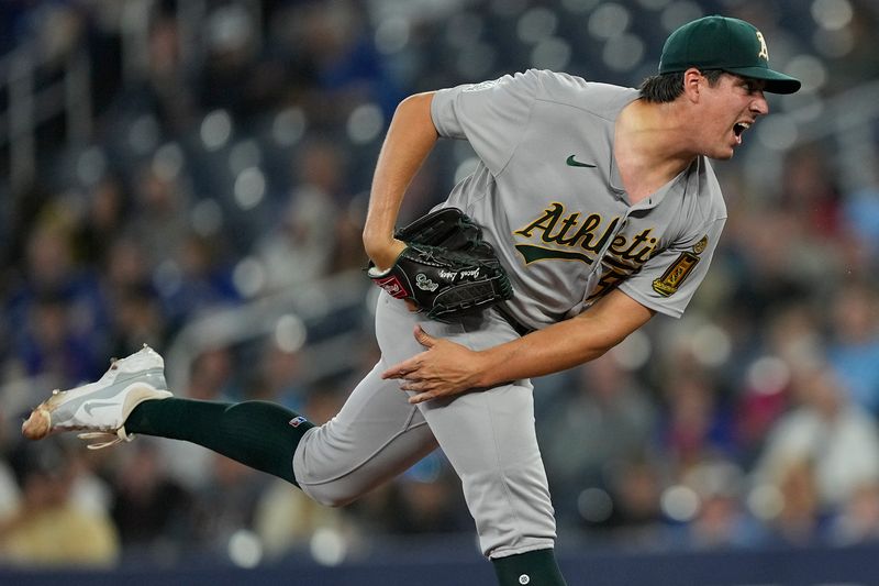 May 29, 2025; Toronto, Ontario, CAN; Athletics starting pitcher Jacob Lopez (57) pitches to the Toronto Blue Jays during the second inning at Rogers Centre. Mandatory Credit: John E. Sokolowski-Imagn Images