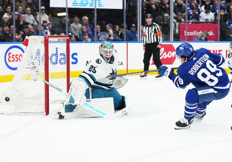 Jan 9, 2024; Toronto, Ontario, CAN; Toronto Maple Leafs left wing Nicholas Robertson (89) attempts a shot on San Jose Sharks goaltender Mackenzie Blackwood (29) during the third period at Scotiabank Arena. Mandatory Credit: Nick Turchiaro-USA TODAY Sports