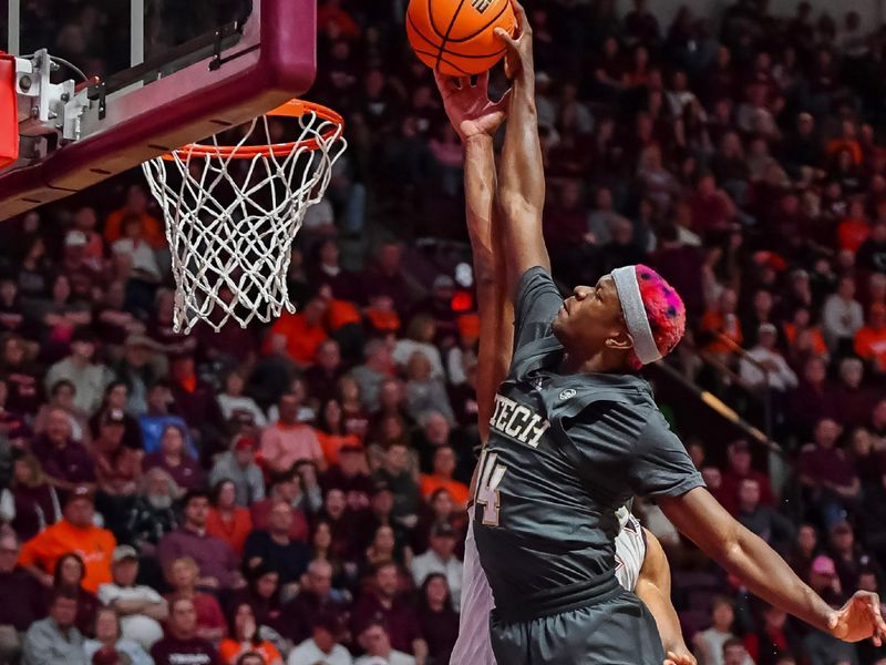 Jan 27, 2024; Blacksburg, Virginia, USA; Georgia Tech Yellow Jackets guard Kowacie Reeves Jr. (14) shoots over Virginia Tech Hokies forward Mylyjael Poteat (34) during the first half at Cassell Coliseum. Mandatory Credit: Brian Bishop-USA TODAY Sports