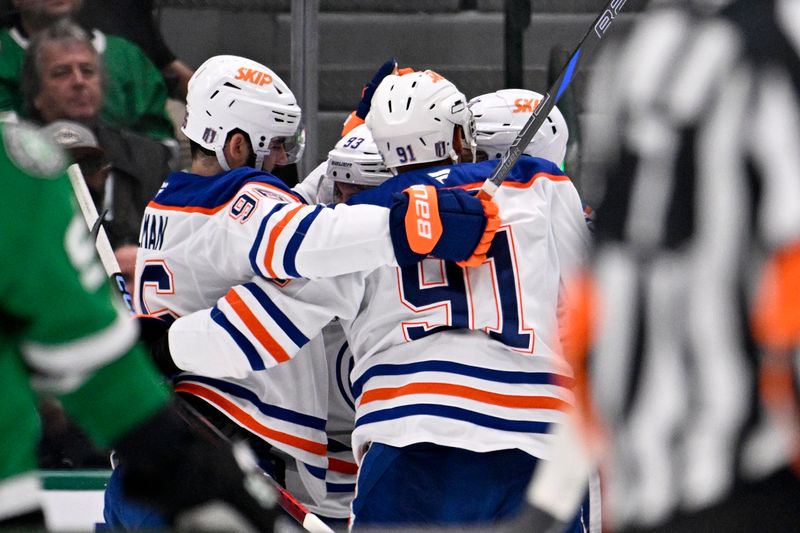 May 23, 2025; Dallas, Texas, USA; Edmonton Oilers defenseman Brett Kulak (27) reacts after scoring a goal against the Dallas Stars in the second period for game two of the Western Conference Final of the 2025 Stanley Cup Playoffs at American Airlines Center. Mandatory Credit: Jerome Miron-Imagn Images