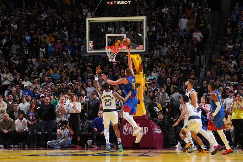 DENVER, CO - NOVEMBER 22: Nikola Jokic #15 of the Denver Nuggets drives to the basket during the game against the Dallas Mavericks during the Emirates NBA Cup game on November 22, 2024 at Ball Arena in Denver, Colorado. NOTE TO USER: User expressly acknowledges and agrees that, by downloading and/or using this Photograph, user is consenting to the terms and conditions of the Getty Images License Agreement. Mandatory Copyright Notice: Copyright 2024 NBAE (Photo by Garrett Ellwood/NBAE via Getty Images)