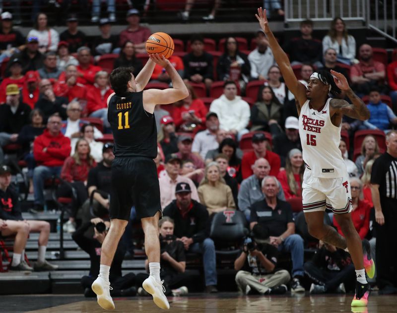 Dec 28, 2025; Lubbock, Texas, USA;  Winthrop Eagles guard Kody Clouet (11) shoots over Texas Tech Red Raiders forward JT Toppin (15) in the first half at United Supermarkets Arena. Mandatory Credit: Michael C. Johnson-Imagn Images