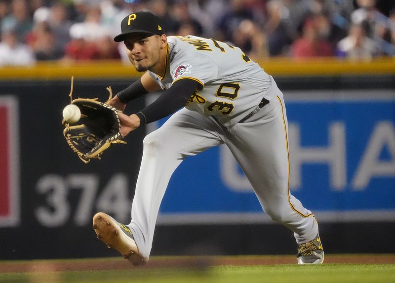 Jul 9, 2023; Phoenix, Arizona, USA;  Pittsburgh Pirates Tucupita Marcano (30) fields a ground ball against the Arizona Diamondbacks at Chase Field. Mandatory Credit: Joe Rondone-USA TODAY Sports