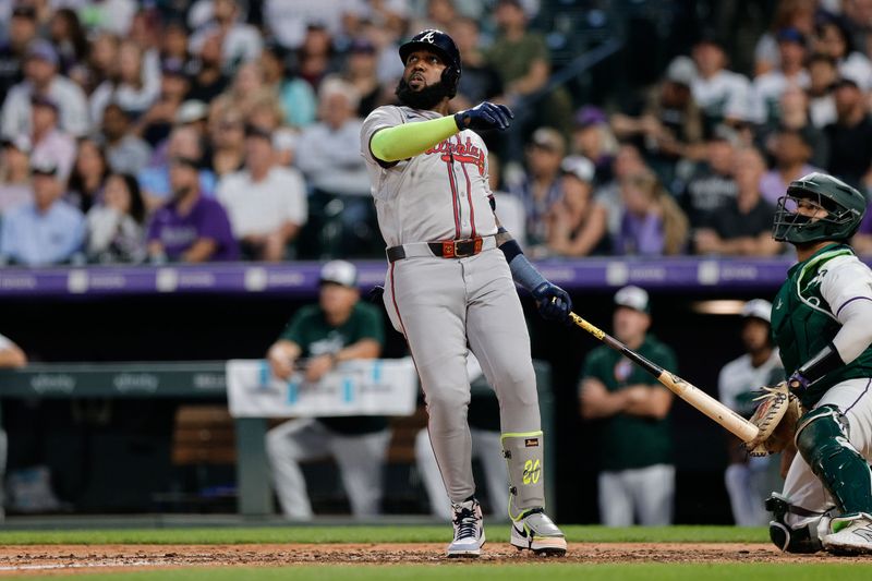 Aug 10, 2024; Denver, Colorado, USA; Atlanta Braves designated hitter Marcell Ozuna (20) watches his ball on a solo home run in the fifth inning against the Colorado Rockies at Coors Field. Mandatory Credit: Isaiah J. Downing-USA TODAY Sports