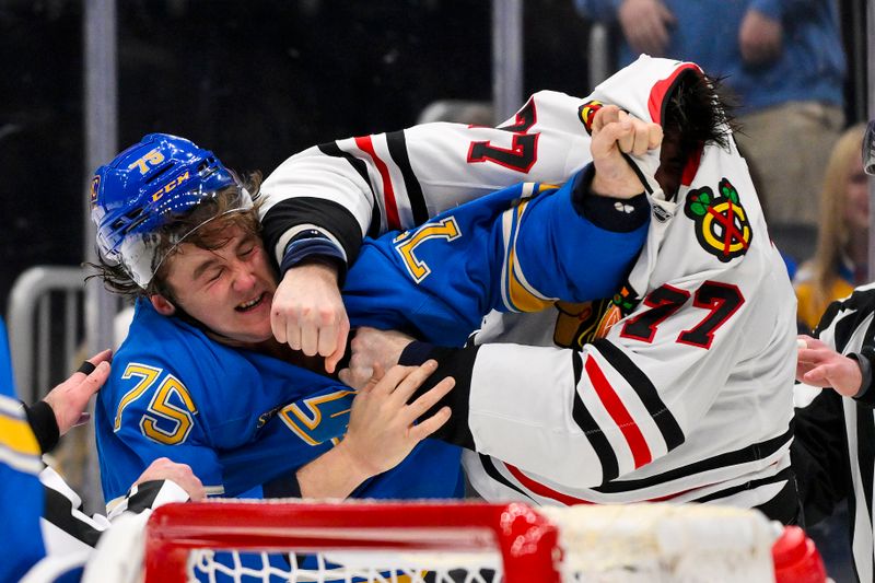 Mar 22, 2025; St. Louis, Missouri, USA;  Chicago Blackhawks left wing Patrick Maroon (77) fights St. Louis Blues defenseman Tyler Tucker (75) during the third period at Enterprise Center. Mandatory Credit: Jeff Curry-Imagn Images