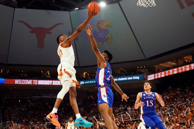 Mar 4, 2023; Austin, Texas, USA; Texas Longhorns guard Sir'Jabari Rice (10) drives to the basket against Kansas Jayhawks forward KJ Adams Jr. (24) during the first half at Moody Center. Mandatory Credit: Scott Wachter-USA TODAY Sports