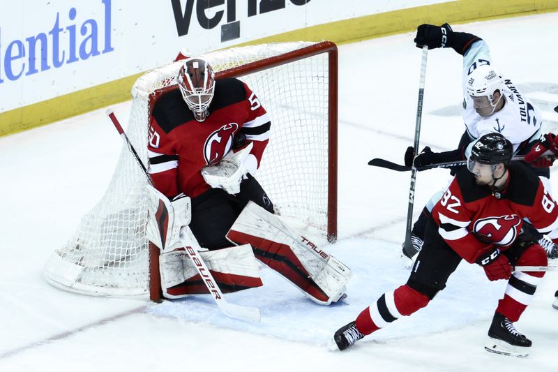 Feb 12, 2024; Newark, New Jersey, USA; New Jersey Devils goaltender Nico Daws (50) makes a save against the Seattle Kraken during the third period at Prudential Center. Mandatory Credit: John Jones-USA TODAY Sports