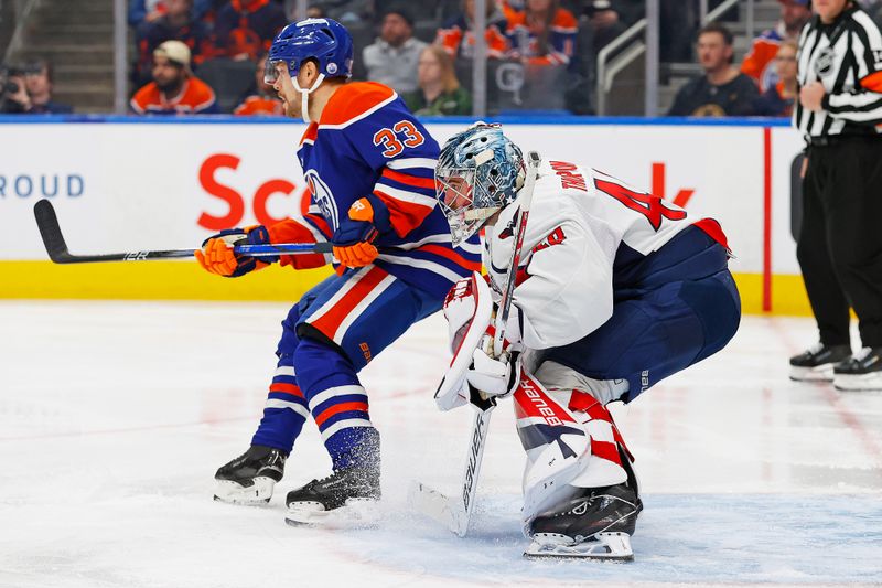 Jan 21, 2025; Edmonton, Alberta, CAN; Edmonton Oilers forward Victor Arvidsson (33) tries to screen Washington Capitals goaltender Logan Thompson (48) during the third period at Rogers Place. Mandatory Credit: Perry Nelson-Imagn Images