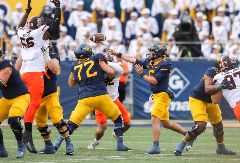 Oct 21, 2023; Morgantown, West Virginia, USA; West Virginia Mountaineers quarterback Garrett Greene (6) throws a pass during the first quarter against the Oklahoma State Cowboys at Mountaineer Field at Milan Puskar Stadium. Mandatory Credit: Ben Queen-USA TODAY Sports