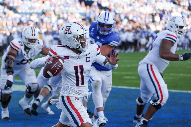 Oct 12, 2024; Provo, Utah, USA; Arizona Wildcats quarterback Noah Fifita (11) passes the ball from his own end zone against the Brigham Young Cougars during the fourth quarter at LaVell Edwards Stadium. Mandatory Credit: Rob Gray-Imagn Images