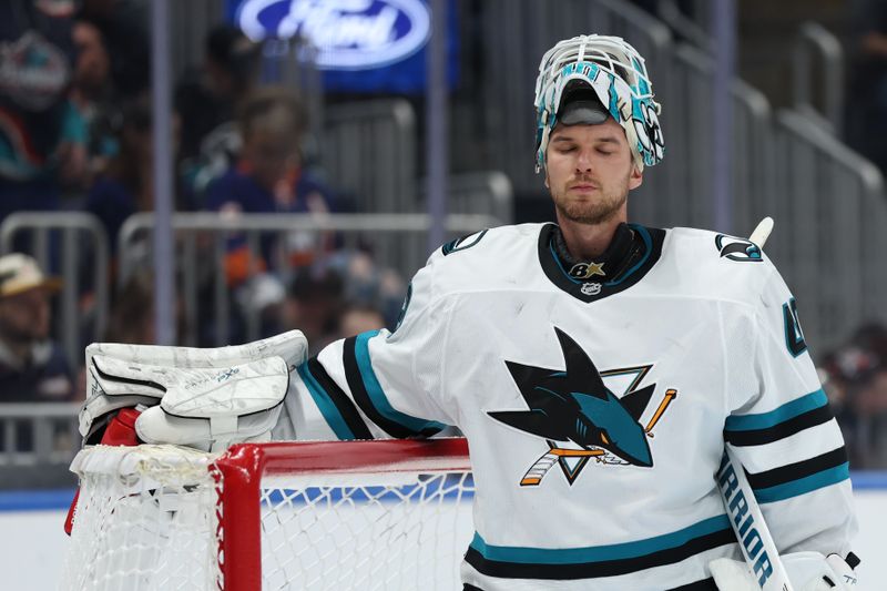 Jan 18, 2025; Elmont, New York, USA;  San Jose Sharks goaltender Alexandar Georgiev (40) relaxes during a stoppage in the play against the New York Islanders during the second period at UBS Arena. Mandatory Credit: Thomas Salus-Imagn Images