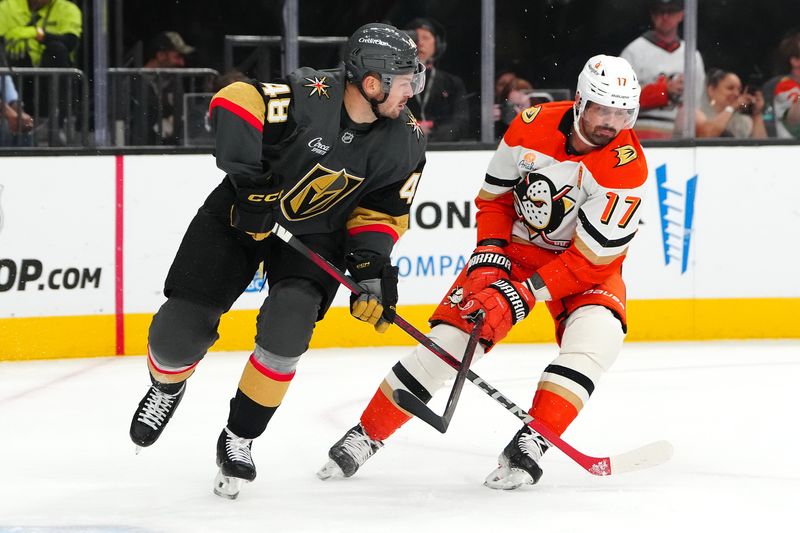 Oct 13, 2024; Las Vegas, Nevada, USA; Anaheim Ducks left wing Alex Killorn (17) slashes the stick of Vegas Golden Knights center Tomas Hertl (48) during the first period at T-Mobile Arena. Mandatory Credit: Stephen R. Sylvanie-Imagn Images