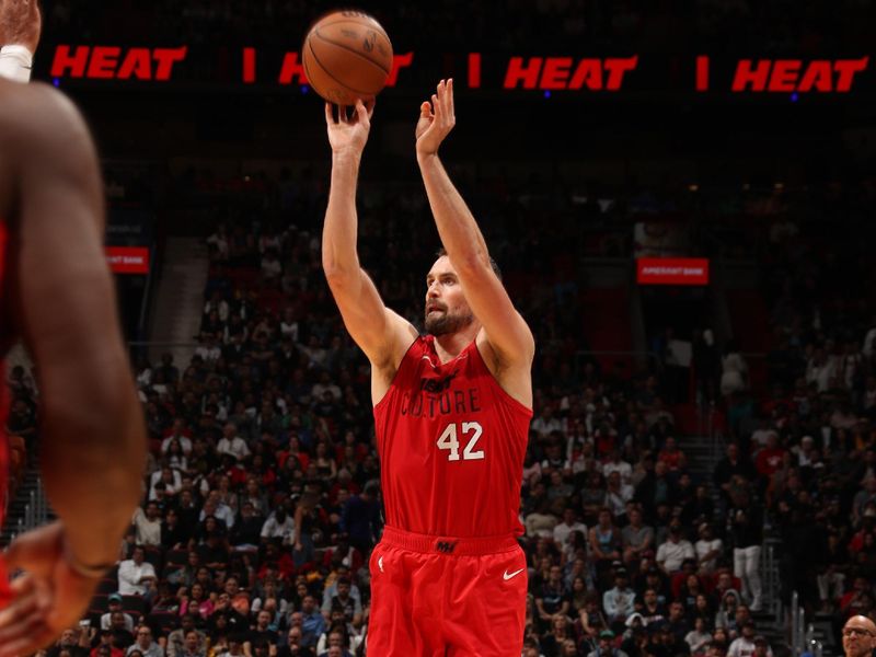 MIAMI, FL - NOVEMBER 24: Kevin Love #42 of the Miami Heat shoots a three point basket during the game against the Dallas Mavericks on November 24, 2024 at Kaseya Center in Miami, Florida. NOTE TO USER: User expressly acknowledges and agrees that, by downloading and or using this Photograph, user is consenting to the terms and conditions of the Getty Images License Agreement. Mandatory Copyright Notice: Copyright 2024 NBAE (Photo by Issac Baldizon/NBAE via Getty Images)