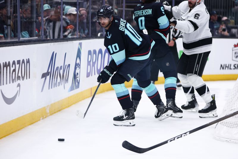 Dec 10, 2025; Seattle, Washington, USA; Seattle Kraken center Matty Beniers (10) passes the puck in the third period against the Los Angeles Kings  at Climate Pledge Arena. Mandatory Credit: Kevin Ng-Imagn Images
