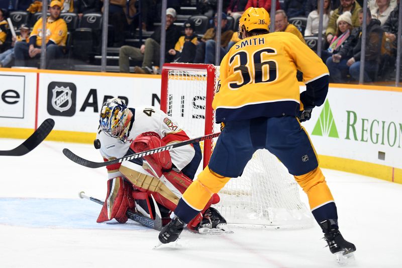 Jan 22, 2024; Nashville, Tennessee, USA; Florida Panthers goaltender Anthony Stolarz (41) makes a save on a shot by Nashville Predators left wing Cole Smith (36) during the first period at Bridgestone Arena. Mandatory Credit: Christopher Hanewinckel-USA TODAY Sports