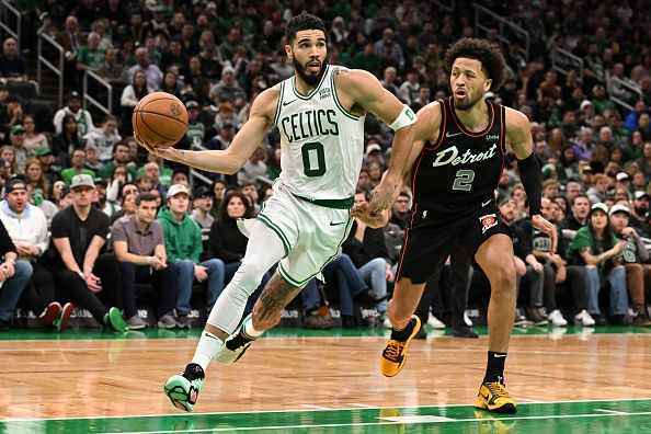 BOSTON, MASSACHUSETTS - DECEMBER 28: Jayson Tatum #0 of the Boston Celtics drives to the basket against Cade Cunningham #2 of the Detroit Pistons during the second quarter at TD Garden on December 28, 2023 in Boston, Massachusetts. NOTE TO USER: User expressly acknowledges and agrees that, by downloading and or using this photograph, User is consenting to the terms and conditions of the Getty Images License Agreement. (Photo by Brian Fluharty/Getty Images)