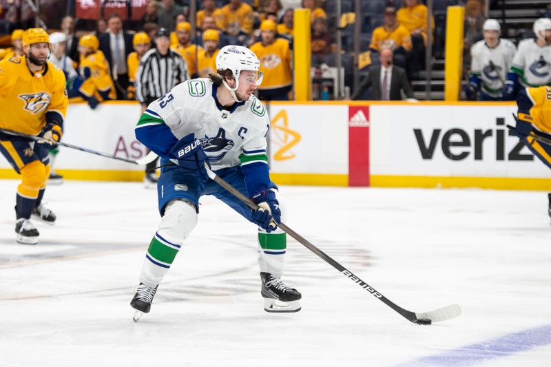 May 3, 2024; Nashville, Tennessee, USA; Vancouver Canucks defenseman Quinn Hughes (43) skates with the puck against the Nashville Predators during the second period in game six of the first round of the 2024 Stanley Cup Playoffs at Bridgestone Arena. Mandatory Credit: Steve Roberts-USA TODAY Sports