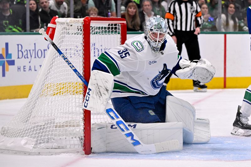 Jan 31, 2025; Dallas, Texas, USA; Vancouver Canucks goaltender Thatcher Demko (35) faces the Dallas Stars attack during the second period at the American Airlines Center. Mandatory Credit: Jerome Miron-Imagn Images