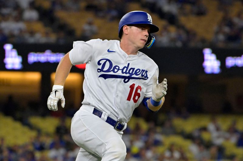 Oct 7, 2023; Los Angeles, California, USA; Los Angeles Dodgers catcher Will Smith (16) runs to first base after a two run triple against the Arizona Diamondbacks during the eighth inning for game one of the NLDS for the 2023 MLB playoffs at Dodger Stadium. Mandatory Credit: Jayne Kamin-Oncea-USA TODAY Sports