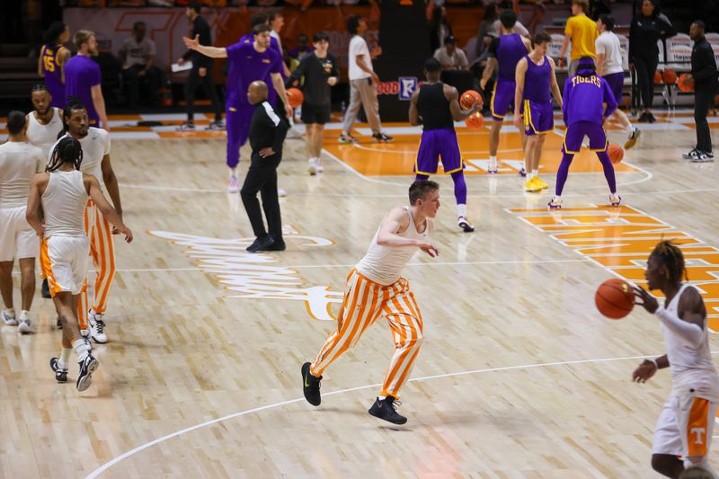 Feb 7, 2024; Knoxville, Tennessee, USA; The Tennessee Volunteers and LSU Tigers warmup before the game at Thompson-Boling Arena at Food City Center. Mandatory Credit: Randy Sartin-USA TODAY Sports