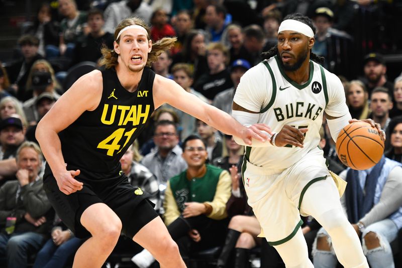 SALT LAKE CITY, UTAH - FEBRUARY 04: Jae Crowder #99 of the Milwaukee Bucks drives around Kelly Olynyk #41 of the Utah Jazz during the first half at Delta Center on February 04, 2024 in Salt Lake City, Utah. NOTE TO USER: User expressly acknowledges and agrees that, by downloading and or using this photograph, User is consenting to the terms and conditions of the Getty Images License Agreement. (Photo by Alex Goodlett/Getty Images)