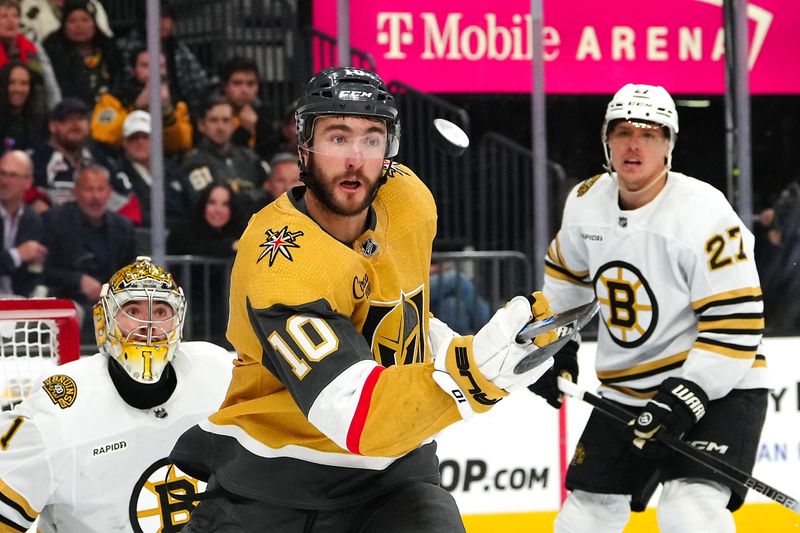 Jan 11, 2024; Las Vegas, Nevada, USA; Vegas Golden Knights center Nicolas Roy (10) follows the puck in front of Boston Bruins goaltender Jeremy Swayman (1) and Boston Bruins defenseman Hampus Lindholm (27) during the second period at T-Mobile Arena. Mandatory Credit: Stephen R. Sylvanie-USA TODAY Sports