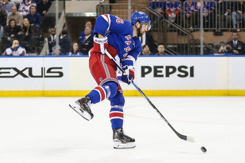 Nov 12, 2023; New York, New York, USA; New York Rangers left wing Jimmy Vesey (26) makes a pass in the first period against the Columbus Blue Jackets at Madison Square Garden. Mandatory Credit: Wendell Cruz-USA TODAY Sports