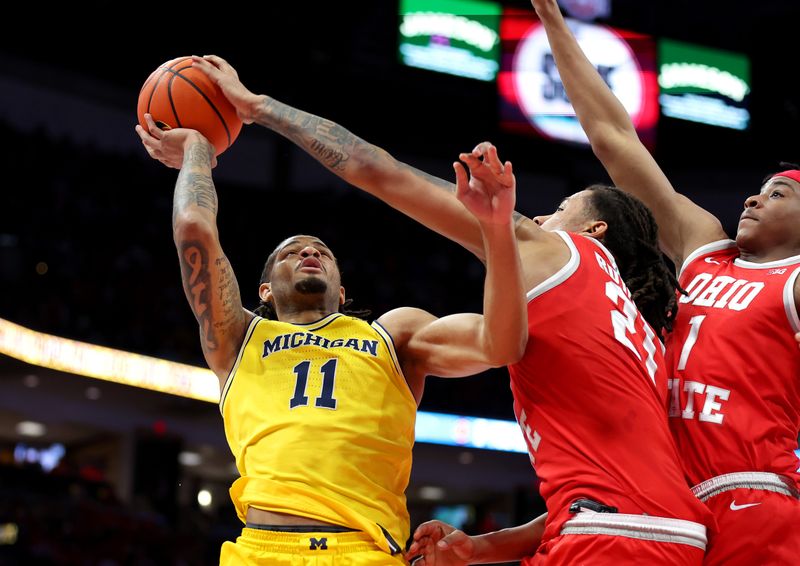 Feb 8, 2026; Columbus, Ohio, USA;  Michigan Wolverines guard Roddy Gayle Jr. (11) drives to the basket as Ohio State Buckeyes forward Devin Royal (21) blocks the shot during the first half at Value City Arena. Mandatory Credit: Joseph Maiorana-Imagn Images
