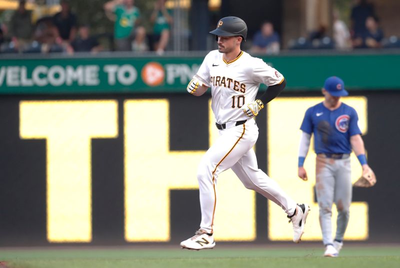 Aug 26, 2024; Pittsburgh, Pennsylvania, USA;  Pittsburgh Pirates left fielder Bryan Reynolds (10) circles the bases on a solo home run against the Chicago Cubs during the third inning at PNC Park. Mandatory Credit: Charles LeClaire-USA TODAY Sports