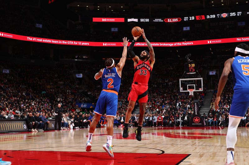 TORONTO, CANADA - MARCH 27: Gary Trent Jr. #33 of the Toronto Raptors shoots the ball during the game against the New York Knicks on March 27, 2024 at the Scotiabank Arena in Toronto, Ontario, Canada.  NOTE TO USER: User expressly acknowledges and agrees that, by downloading and or using this Photograph, user is consenting to the terms and conditions of the Getty Images License Agreement.  Mandatory Copyright Notice: Copyright 2024 NBAE (Photo by Vaughn Ridley/NBAE via Getty Images)