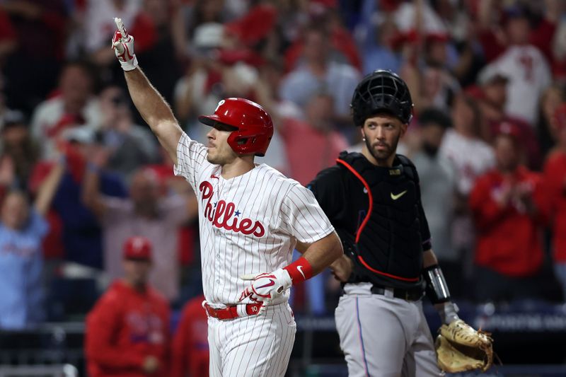 Oct 4, 2023; Philadelphia, Pennsylvania, USA; Philadelphia Phillies catcher J.T. Realmuto (10) reacts after hitting a solo home run against the Miami Marlins during the fourth inning for game two of the Wildcard series for the 2023 MLB playoffs at Citizens Bank Park. Mandatory Credit: Bill Streicher-USA TODAY Sports