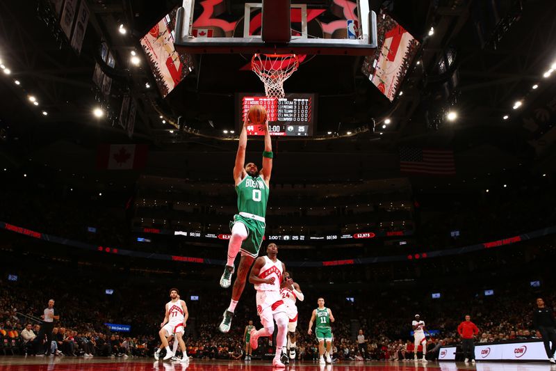 TORONTO, CANADA - OCTOBER 15: Jayson Tatum #0 of the Boston Celtics drives to the basket during the game against the Toronto Raptors on October 15, 2024 at the Scotiabank Arena in Toronto, Ontario, Canada.  NOTE TO USER: User expressly acknowledges and agrees that, by downloading and or using this Photograph, user is consenting to the terms and conditions of the Getty Images License Agreement.  Mandatory Copyright Notice: Copyright 2024 NBAE (Photo by Vaughn Ridley/NBAE via Getty Images)