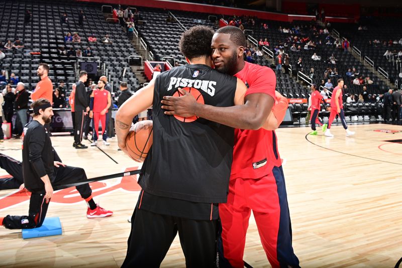 DETROIT, MI - JANUARY 27: Cade Cunningham #2 of the Detroit Pistons embrace Eugene Omoruyi #97 of the Washington Wizards before the game on January 27, 2024 at Little Caesars Arena in Detroit, Michigan. NOTE TO USER: User expressly acknowledges and agrees that, by downloading and/or using this photograph, User is consenting to the terms and conditions of the Getty Images License Agreement. Mandatory Copyright Notice: Copyright 2024 NBAE (Photo by Chris Schwegler/NBAE via Getty Images)