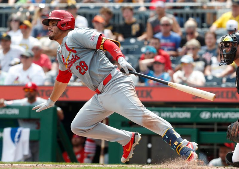 Jul 24, 2024; Pittsburgh, Pennsylvania, USA;  St. Louis Cardinals third baseman Nolan Arenado (28) hits a single against the Pittsburgh Pirates during the eighth inning at PNC Park. Mandatory Credit: Charles LeClaire-USA TODAY Sports