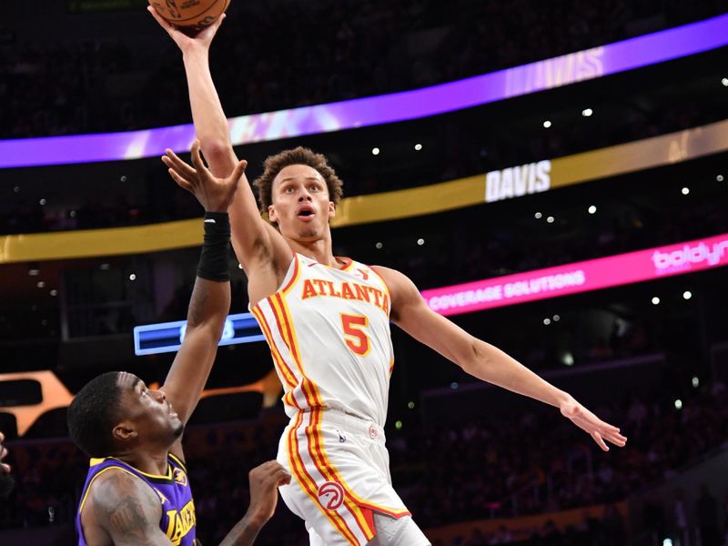 LOS ANGELES, CA - JANUARY 3:  Dyson Daniels #5 of the Atlanta Hawks drives to the basket during the game against the Los Angeles Lakers on January 3, 2025 at Crypto.Com Arena in Los Angeles, California. NOTE TO USER: User expressly acknowledges and agrees that, by downloading and/or using this Photograph, user is consenting to the terms and conditions of the Getty Images License Agreement. Mandatory Copyright Notice: Copyright 2025 NBAE (Photo by Juan Ocampo/NBAE via Getty Images)