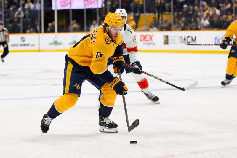 Feb 25, 2025; Nashville, Tennessee, USA; Nashville Predators center Jonathan Marchessault (81) skates with the puck against the Florida Panthers during the first period at Bridgestone Arena. Mandatory Credit: Steve Roberts-Imagn Images