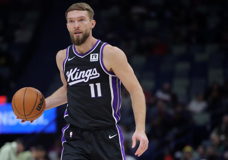 NEW ORLEANS, LOUISIANA - DECEMBER 12: Domantas Sabonis #11 of the Sacramento Kings drives with the ball against the New Orleans Pelicans during a game at the Smoothie King Center on December 12, 2024 in New Orleans, Louisiana. NOTE TO USER: User expressly acknowledges and agrees that, by downloading and or using this Photograph, user is consenting to the terms and conditions of the Getty Images License Agreement. (Photo by Jonathan Bachman/Getty Images)