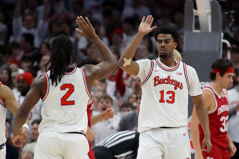 Jan 17, 2025; Columbus, Ohio, USA; Ohio State Buckeyes forward Sean Stewart (13) celebrates a basket with Ohio State Buckeyes guard Bruce Thornton (2) during the first half against the Indiana Hoosiers at Value City Arena. Mandatory Credit: Joseph Maiorana-Imagn Images