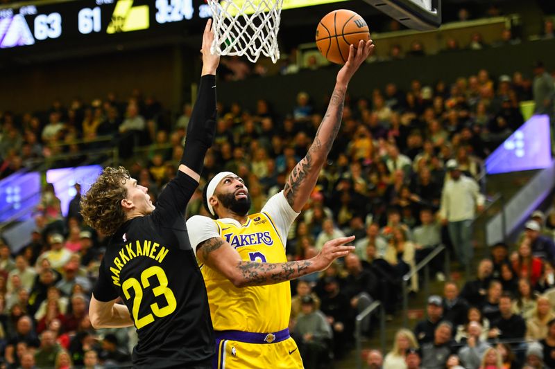 SALT LAKE CITY, UTAH - FEBRUARY 14: Anthony Davis #3 of the Los Angeles Lakers shoots over Lauri Markkanen #23 of the Utah Jazz during the first half of a game at Delta Center on February 14, 2024 in Salt Lake City, Utah. NOTE TO USER: User expressly acknowledges and agrees that, by downloading and or using this photograph, User is consenting to the terms and conditions of the Getty Images License Agreement. (Photo by Alex Goodlett/Getty Images)