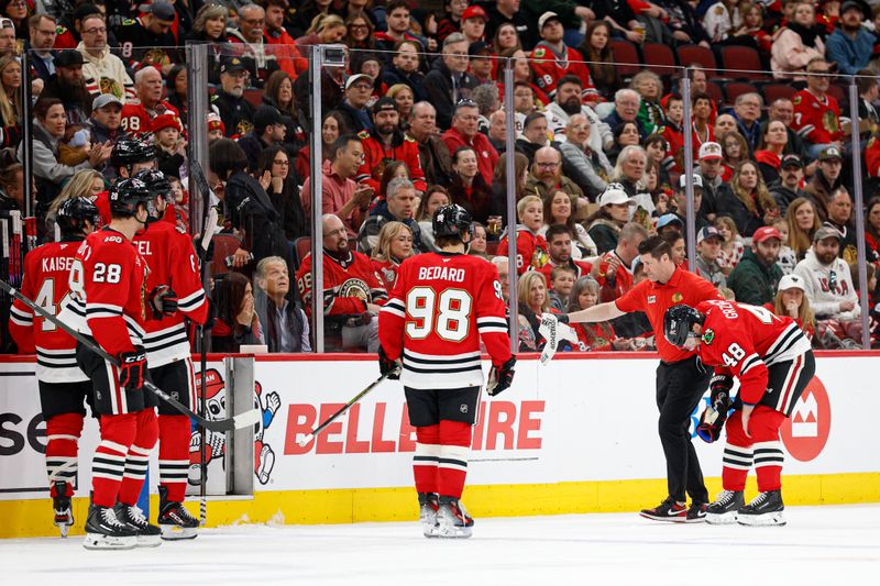 Mar 22, 2026; Chicago, Illinois, USA; Chicago Blackhawks defenseman Matt Grzelcyk (48) leaves an NHL game against the Nashville Predators due to injury during the first period at United Center. Mandatory Credit: Kamil Krzaczynski-Imagn Images