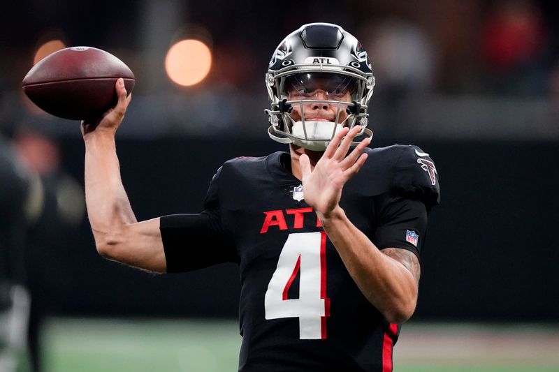 Atlanta Falcons quarterback Desmond Ridder (4) warms up before playing the New Orleans Saints in an NFL football game, Sunday, Sept. 11, 2022 in Atlanta. (AP Photo/John Bazemore)