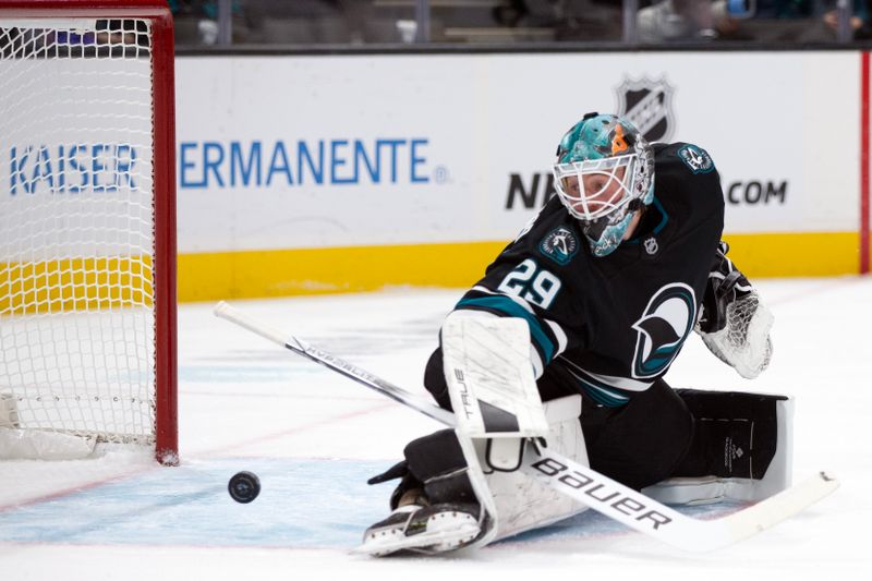 Oct 31, 2024; San Jose, California, USA; San Jose Sharks goaltender Mackenzie Blackwood (29) watches a shot by Chicago Blackhawks center Ryan Donato go by for a goal during the first period at SAP Center at San Jose. Mandatory Credit: D. Ross Cameron-Imagn Images